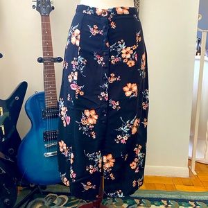 Black pencil skirt with bright orange floral from Divided by H&M. Size 4.
